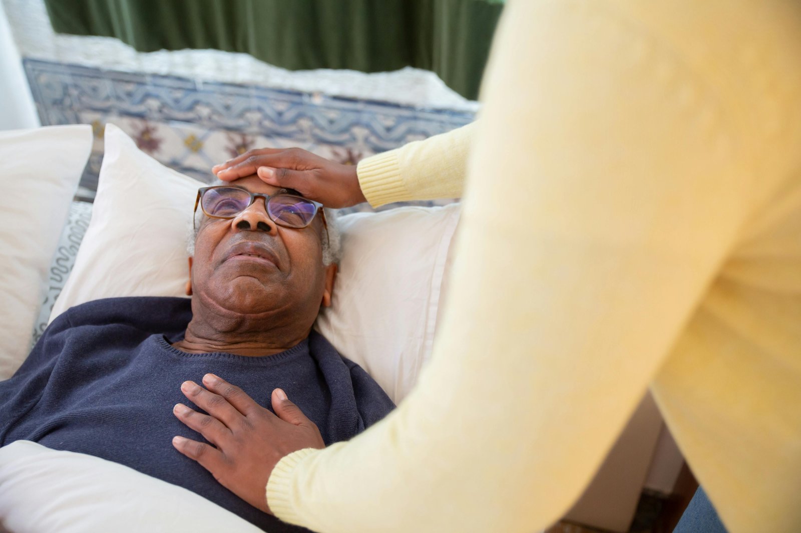 Caregiver helping a senior woman with daily personal care at home